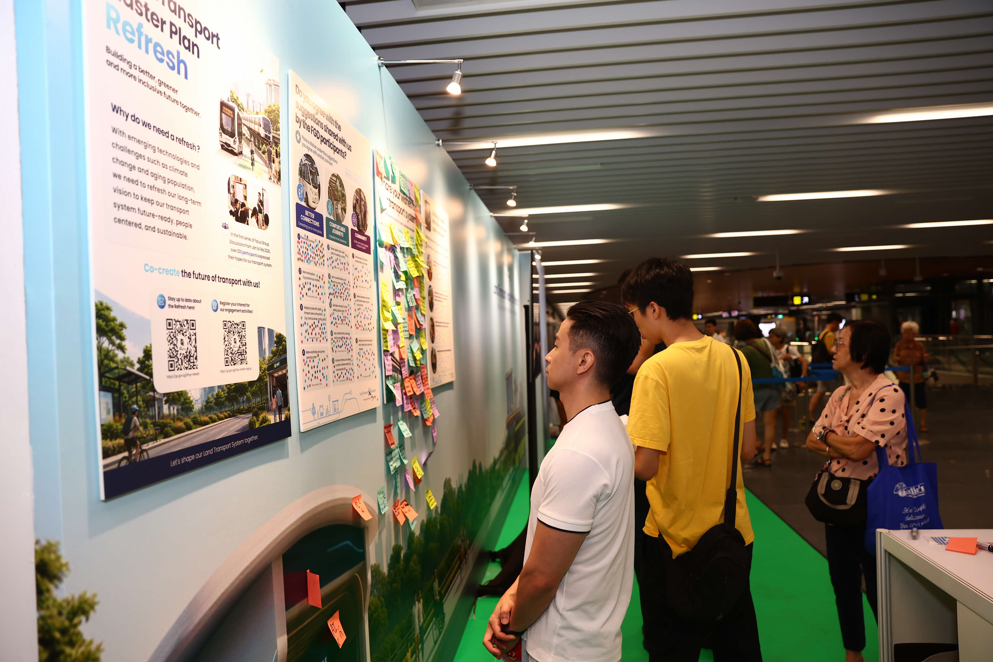 Image of a man looking at a poster 